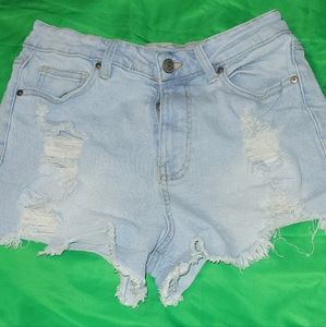 Light blue jeans shorts distressed.